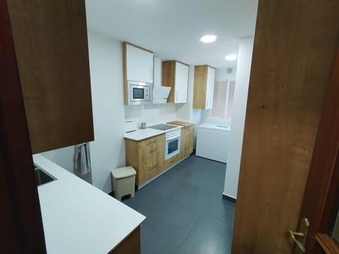 Kitchen or kitchenette, oven, stove