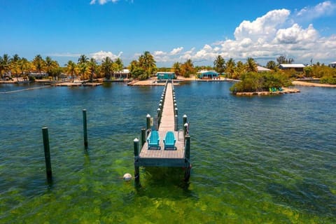 Waterfront Cozy Cottage with Boat Ramp & Dock House in Little Torch Key