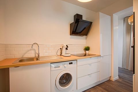 Kitchen or kitchenette, washing machine