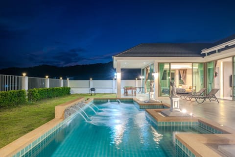 Property building, Patio, Night, Natural landscape, Pool view, Swimming pool, sunbed