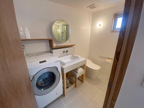 Toilet, Bathroom, towels, washing machine, dryer