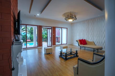 Living room, Seating area, Pool view