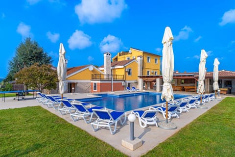 Property building, Patio, Pool view, Swimming pool, sunbed