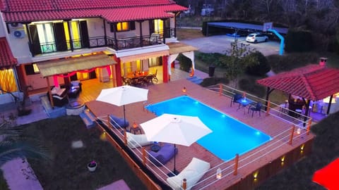 Property building, Patio, Night, Pool view, Swimming pool, sunbed