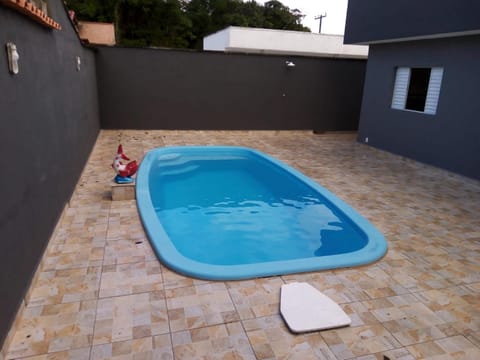 Casa com piscina em condomínio fechado House in Peruíbe