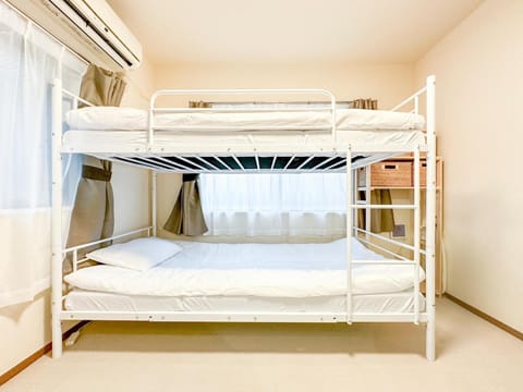 Bed, Photo of the whole room, Bedroom, bunk bed, towels, air conditioner