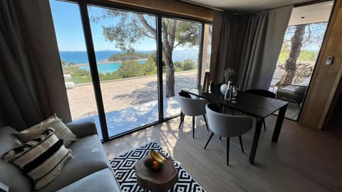 View (from property/room), Living room, Seating area, Dining area, Sea view