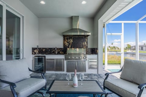 BRAND NEW - Pool overlooking canal, Outdoor Grilling station - Villa Hummingbird House - Roelens House in Cape Coral