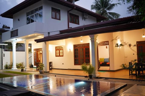 Property building, Patio, Night, Pool view, Swimming pool