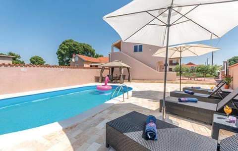 Patio, Day, Natural landscape, Pool view, Swimming pool, sunbed