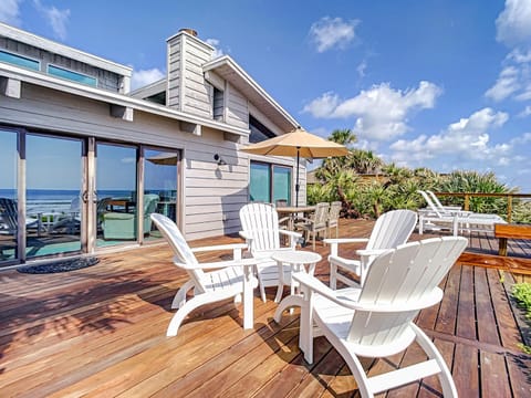 Beachfront Deck with steps down to the white sandy beach Sea Dunes Sandcastle 1A Condo in Edgewater