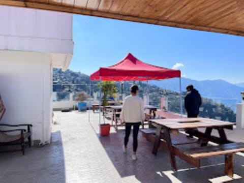 Property building, Restaurant/places to eat, Day, People, Natural landscape, View (from property/room), Balcony/Terrace, Dining area, Mountain view, Sea view