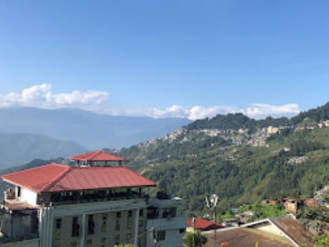 Property building, Nearby landmark, Day, Natural landscape, Mountain view