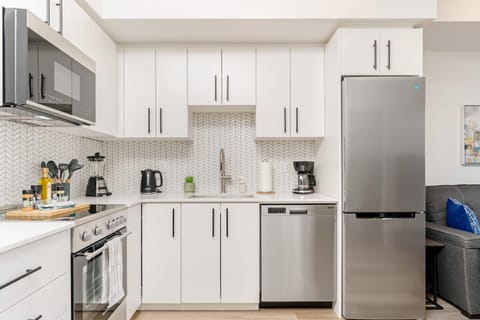 Kitchen or kitchenette, dishwasher, oven, stove