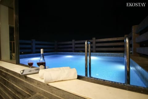 Patio, Night, Pool view, Swimming pool, sunbed, towels