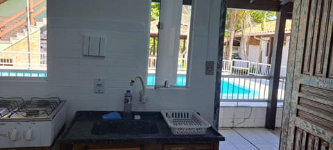 Kitchen or kitchenette, Pool view, stove