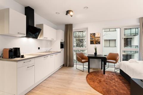 Kitchen or kitchenette, Photo of the whole room, Dining area, stove