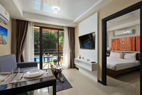 Bed, TV and multimedia, Living room, Photo of the whole room, Seating area, Bedroom, Pool view, hair dresser