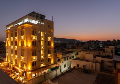 Property building, Facade/entrance, Night, Property logo or sign, Neighbourhood, City view, Mountain view, Sunset