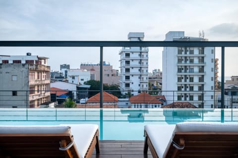 View (from property/room), Balcony/Terrace, Seating area, City view, Pool view, Swimming pool