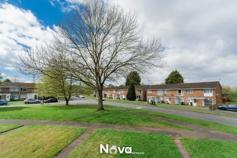 Property building, Spring, Day, Neighbourhood, Natural landscape, Text overlay, Street view, Location, Parking