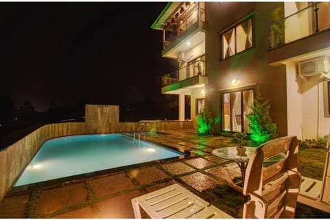 Property building, Patio, Night, View (from property/room), Balcony/Terrace, Pool view, Swimming pool, sunbed