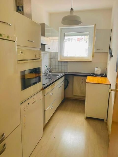 Kitchen or kitchenette, dishwasher, oven, stove