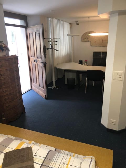 Bedroom cum office with shared shower in Zug's Old Town Bed and Breakfast in Zug