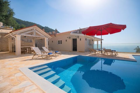 Property building, Patio, View (from property/room), Sea view, Swimming pool