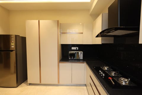 Kitchen or kitchenette, microwave, stove, kitchen