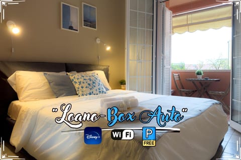 Bed, Balcony/Terrace, Bedroom, Text overlay, City view, towels