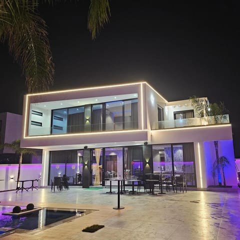 Property building, Patio, Night, Pool view, Swimming pool