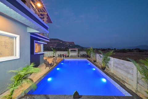 Patio, Night, Pool view, Swimming pool, sunbed