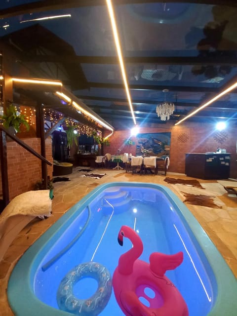 Communal lounge/ TV room, Night, Evening entertainment, Pool view, Swimming pool