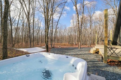 Modern A-frame in woods' embrace with a Hot Tub Haus in Hickory Run State Park