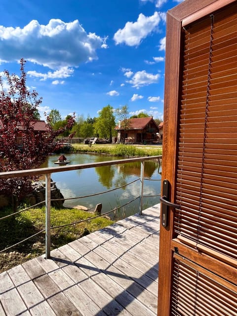 Property building, Spring, Day, Natural landscape, Garden, View (from property/room), Balcony/Terrace, Lake view, River view