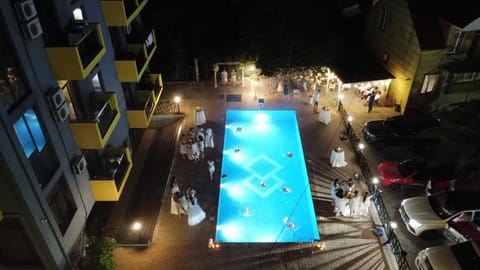 Property building, Patio, Night, Pool view, Swimming pool, Parking