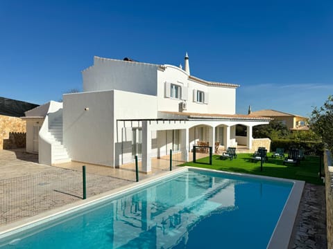 Property building, Patio, Swimming pool, sunbed