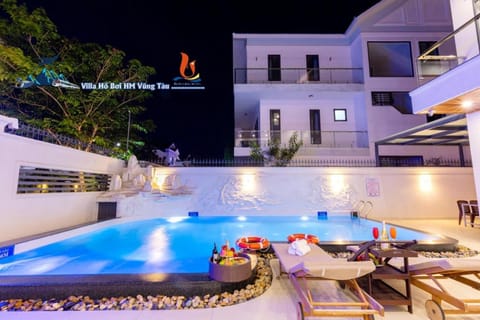 Property building, Patio, Night, Natural landscape, Pool view, Swimming pool, sunbed