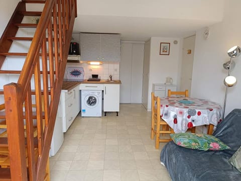 Living room, Dining area, oven, stove, toaster, washing machine