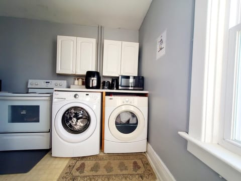 Kitchen or kitchenette, dishwasher, oven, stove, toaster, washing machine, dryer