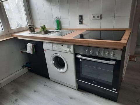 Kitchen or kitchenette, stove, washing machine