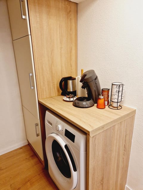 Kitchen or kitchenette, washing machine