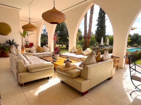 Patio, Living room, Seating area, Dining area, Pool view