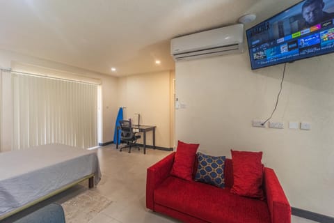 Bed, TV and multimedia, Living room, Seating area, Bedroom, air conditioner