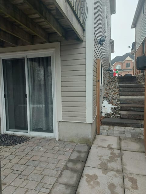 TIMATT'S PLACE . Welcome to your home away from home! This walkout basement has a private entrance, newly constructed with full bathroom and kitchen amenities, a spacious living room, indoor and outdoor dining areas, and a comfortable bedroom. Apartment in Bowmanville