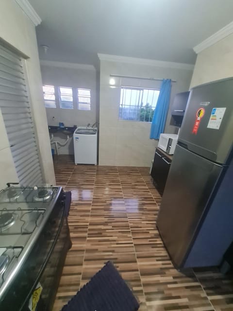 Kitchen or kitchenette, minibar, stove, washing machine