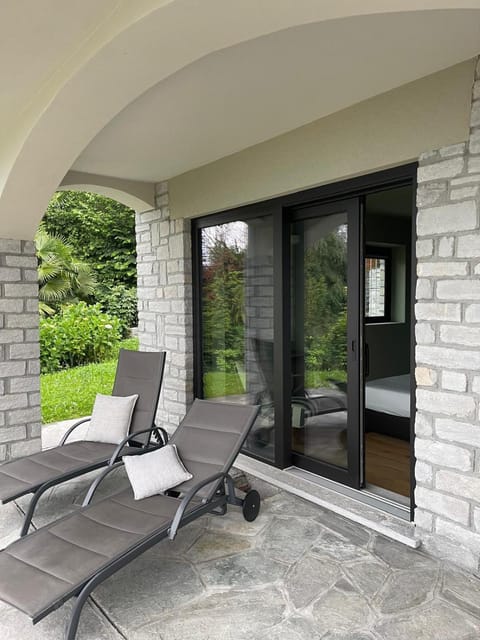 Property building, Patio, Garden, View (from property/room), Seating area, Garden view, Lake view, sunbed