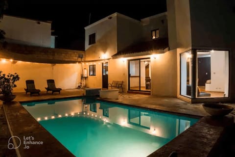 Property building, Patio, Night, Pool view, Swimming pool, sunbed