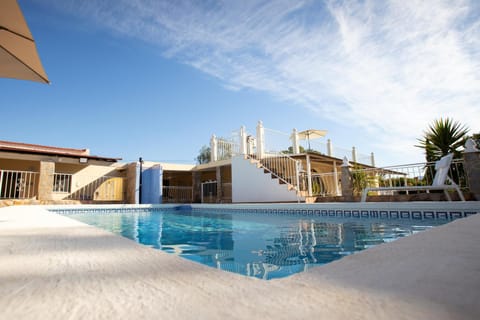 Property building, Living room, Swimming pool